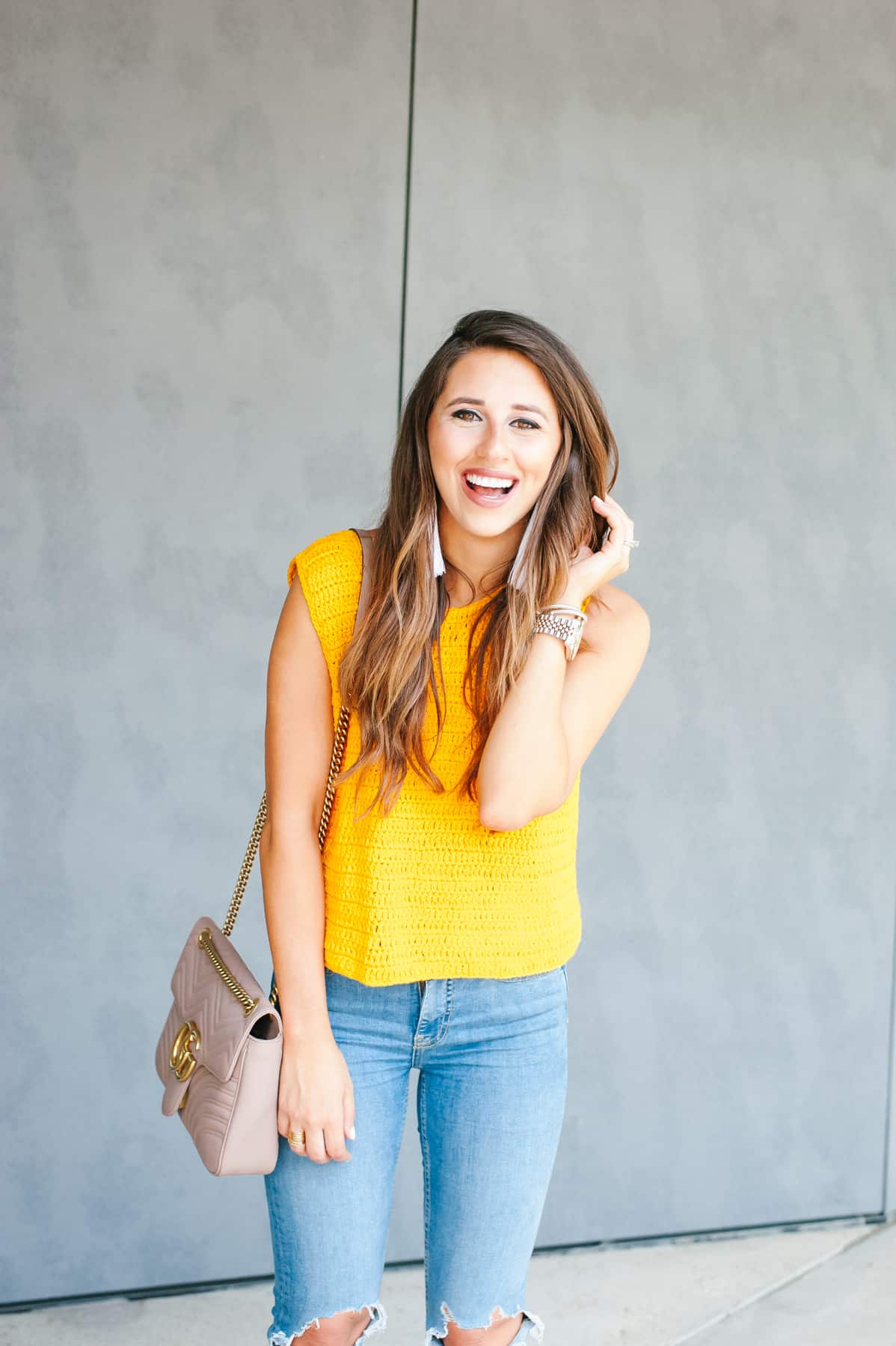 Dress Up Buttercup, Dede Raad, Houston Blogger, Fashion Blogger, Mellow Knit Yellow, knit top, ripped jeans, tassel earrings