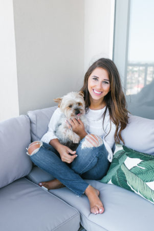 Dress Up Buttercup, Dede Raad, Houston Blogger, Fashion blogger, Patio Furniture,Gray outdoor seating, palm leaf pillow, ripped jeans, cute puppy