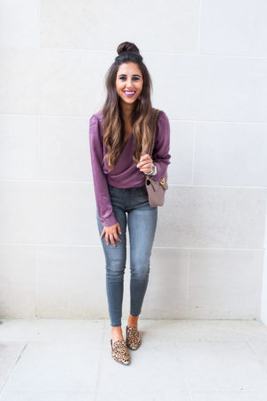 fashion blogger girl in plum fall sateen color top and grey wash jeans with leopard shoes