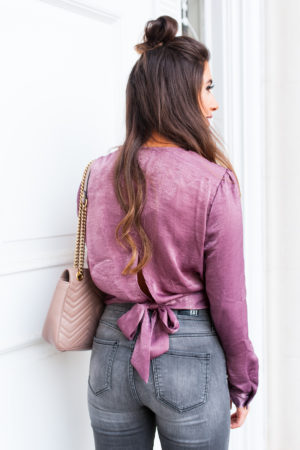 gray wash denim jeans with purple top