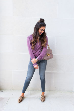 fashion blogger girl in plum fall sateen color top and grey wash jeans with leopard shoes
